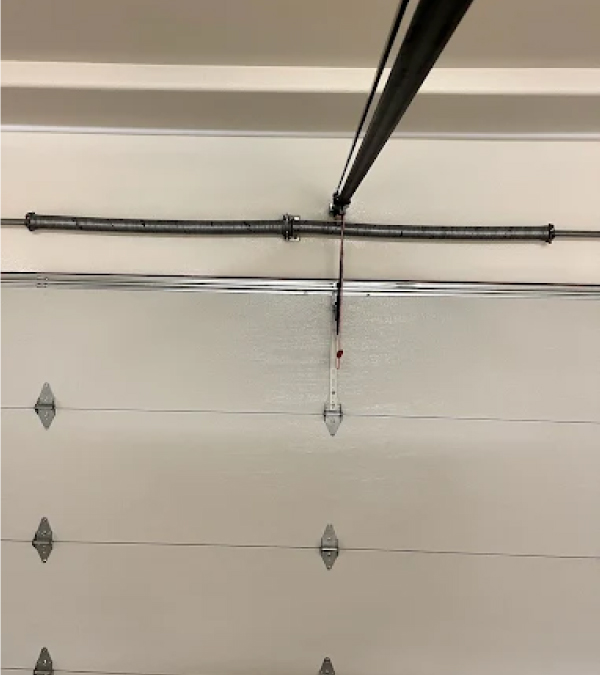 Precision repair process for a broken spring included in a full Garage door spring replacement in Selma, CA
